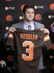 Cleveland Browns' Cody Kessler holds up his jersey during a news conference at the NFL football team's training camp facility, Saturday, April 30, 2016, in Berea, Ohio. Kessler was a quarterback at USC. (AP Photo/Tony Dejak)